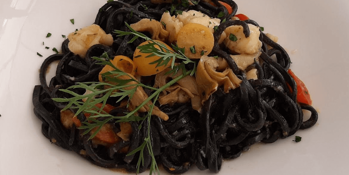 Black Taglioni with monkfish, squid ink and artichokes