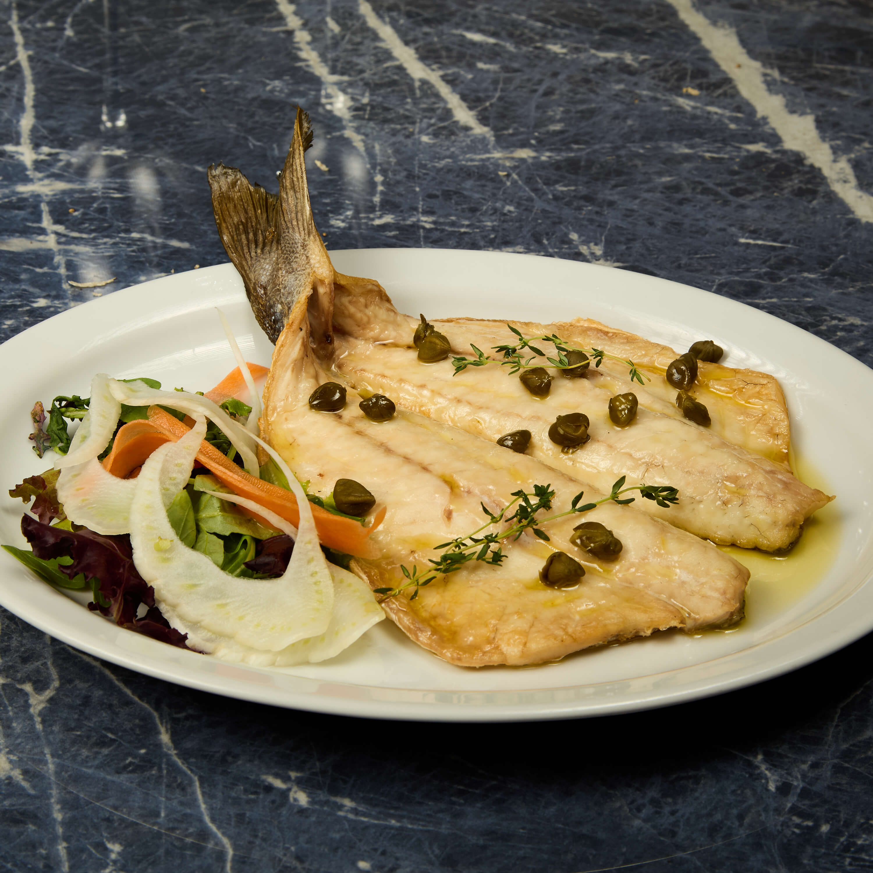 Loup à la méditerranéenne - Avenue 31 | Livraison Cuisine Méditerranéenne à Monaco