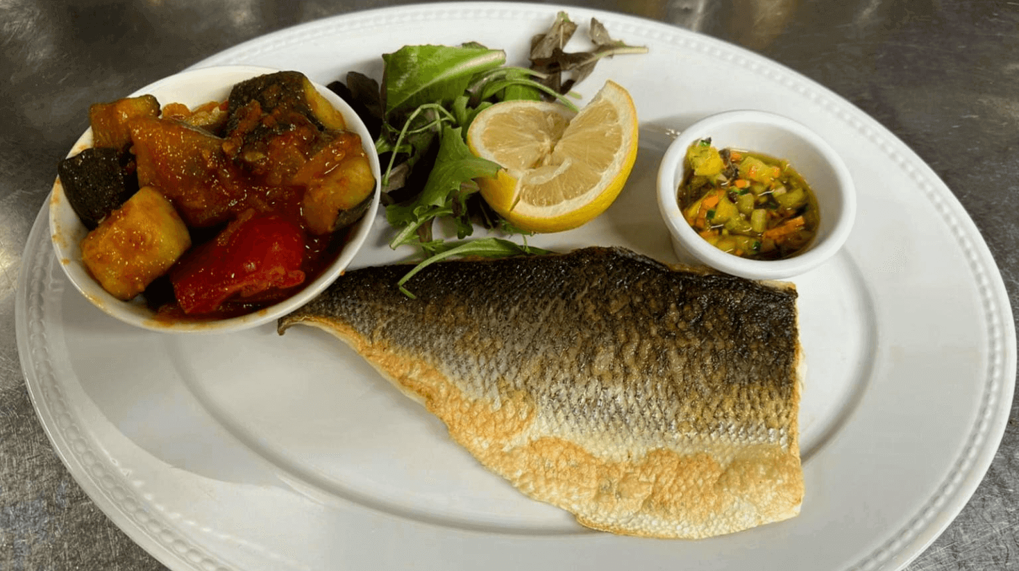 Sea bream filet, red bell peppers cream, candied red onions & ratatouille - Bella Vita | Italian & French Cuisine Delivery in Monaco, Cap-d'Ail & Beausoleil