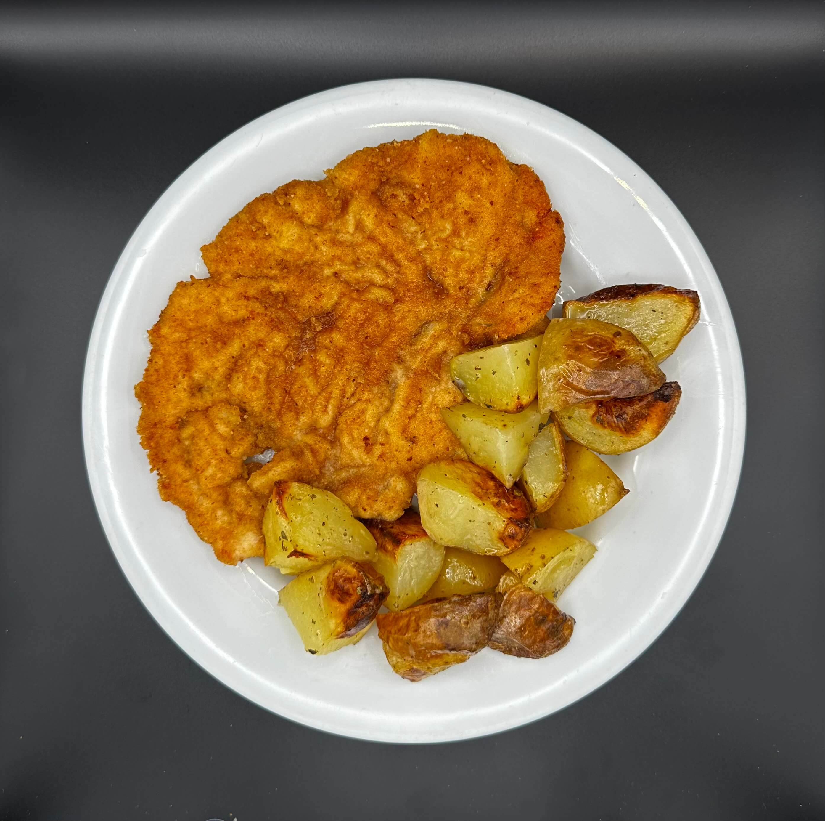Turkey Milanese with potatoes - Cooks | Delivery in Monaco